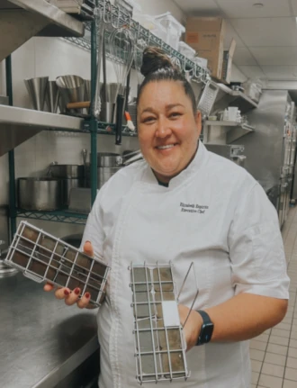 Elizabeth Espiritu, Executive Chef, Archer Hotels holds 2 Frylow Oil Savers