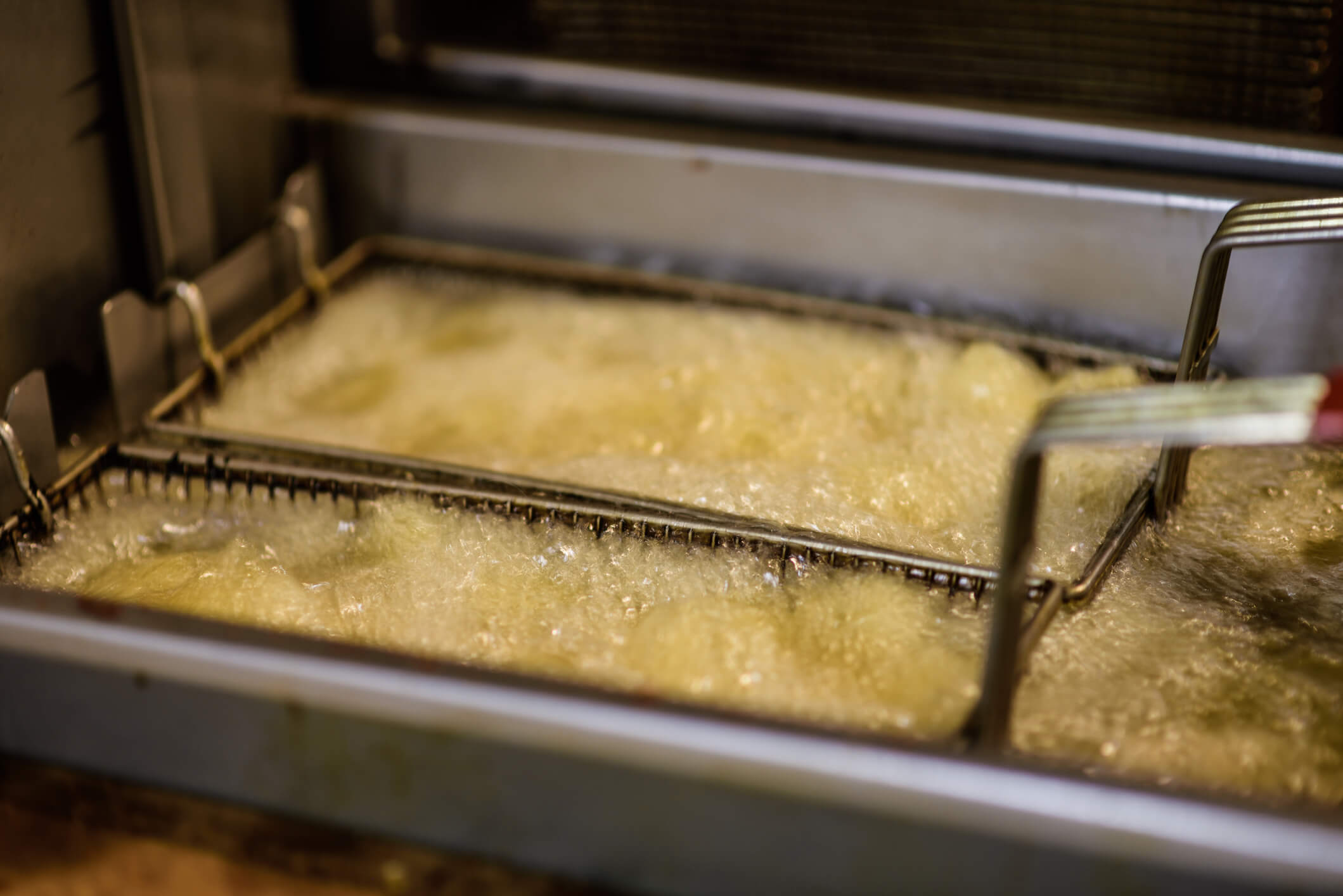 Deep frying food in canola oil money-saving device Frylow