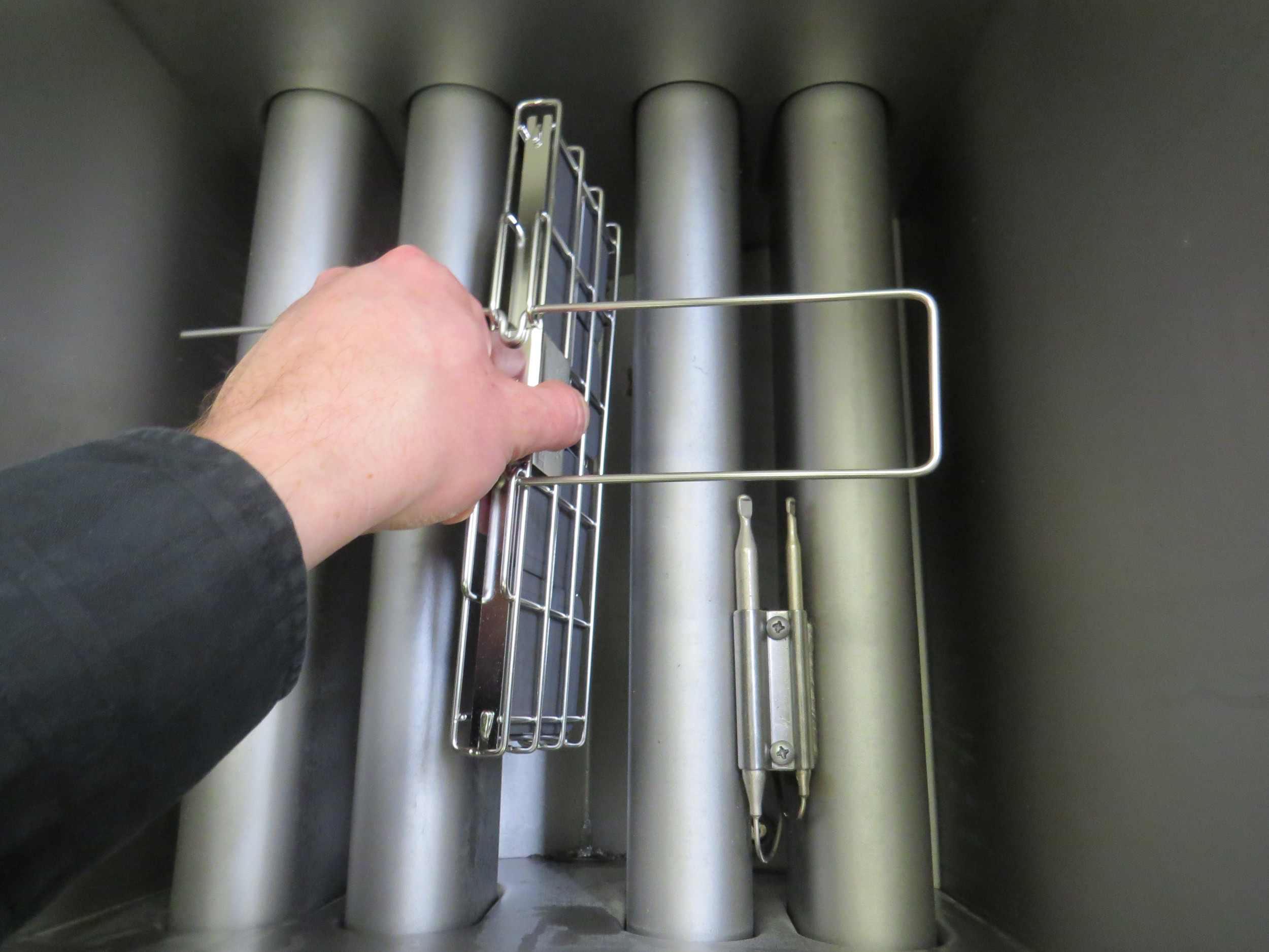 A Frylow is easy to install into a restaurant deep fryer as demonstrated.