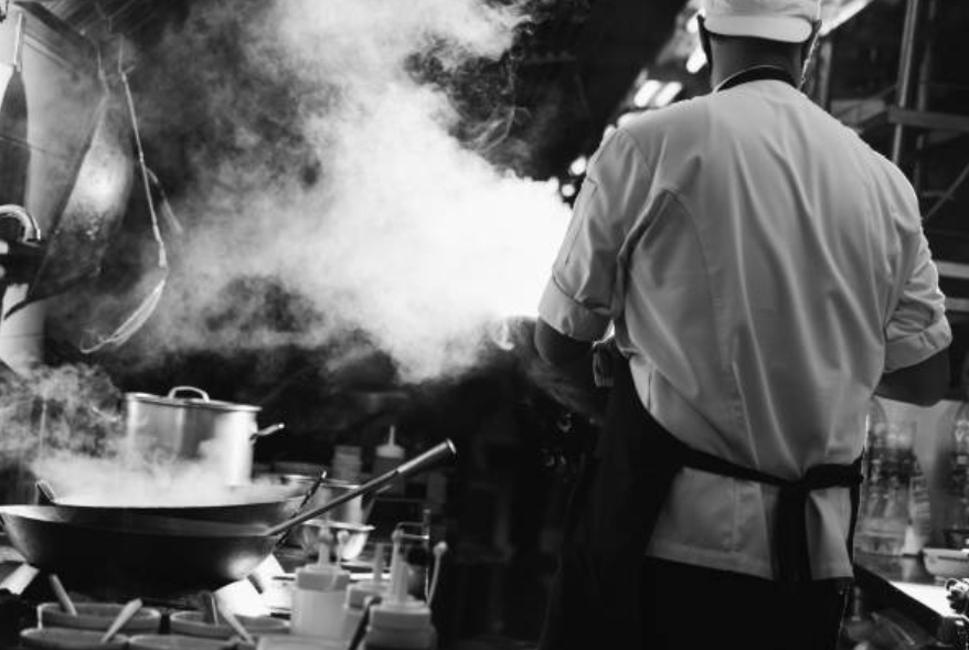 Frylow was developed in Japan and known for its superior kitchen craftsmanship. A Japanese chef is pictured tempura frying.