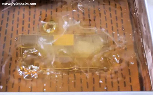 The frying oil bubbles for a moment while Frylow supercharges the oil molecules.